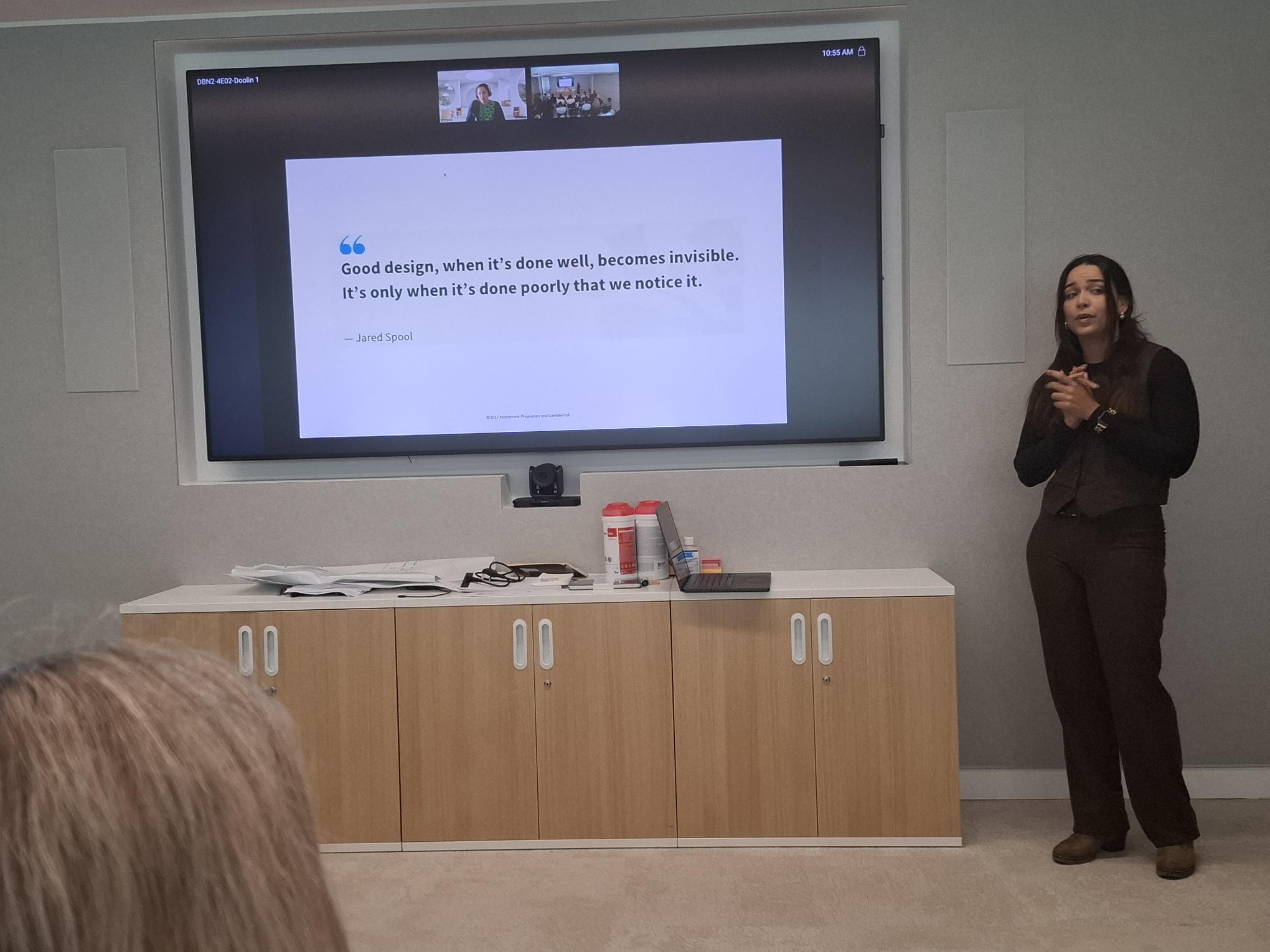 Jessica presenting a talk about good design being invisible